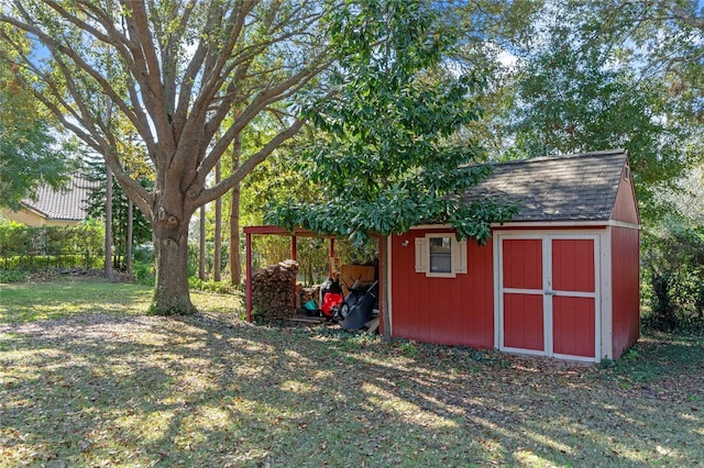 view of outbuilding featuring a yard