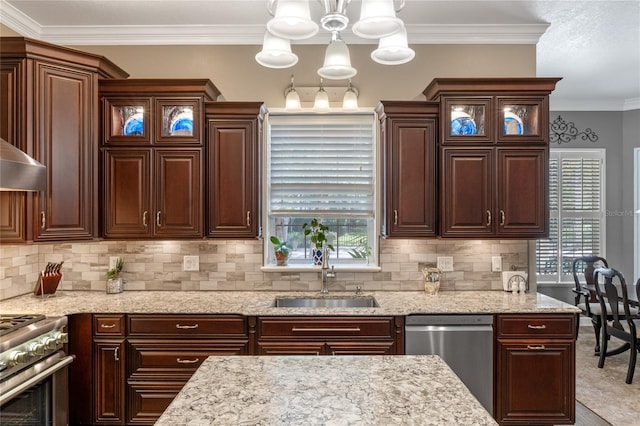 kitchen featuring a sink, appliances with stainless steel finishes, decorative backsplash, glass insert cabinets, and crown molding