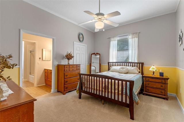 bedroom with baseboards, ornamental molding, connected bathroom, and light colored carpet