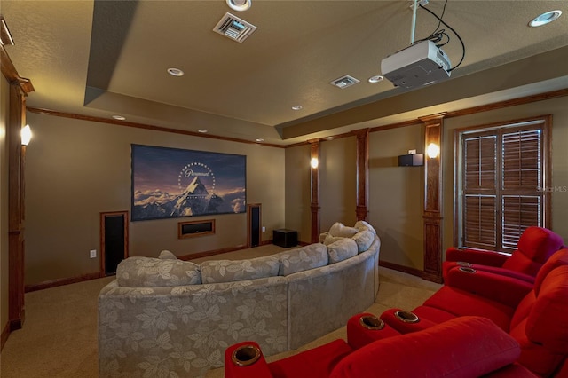 home theater featuring recessed lighting, light carpet, visible vents, baseboards, and a raised ceiling