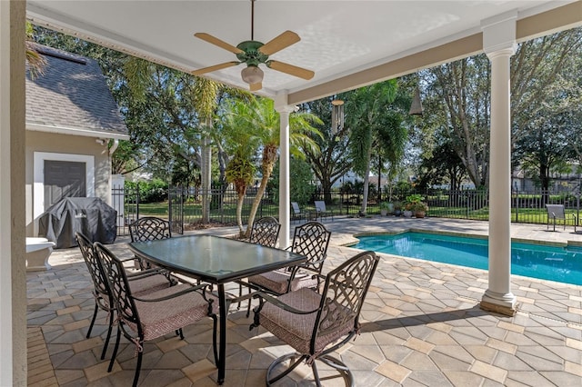 view of pool featuring area for grilling, a patio area, and fence