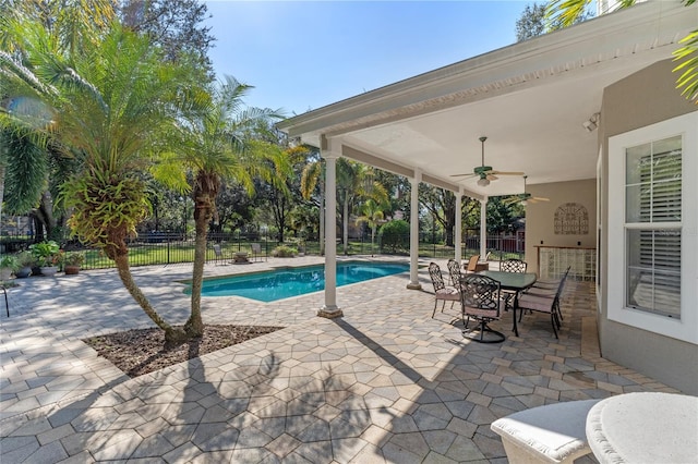 view of swimming pool with a patio, a fenced backyard, a ceiling fan, and a fenced in pool