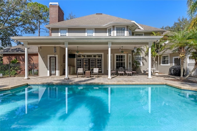 view of pool with a fenced in pool, a patio area, and fence