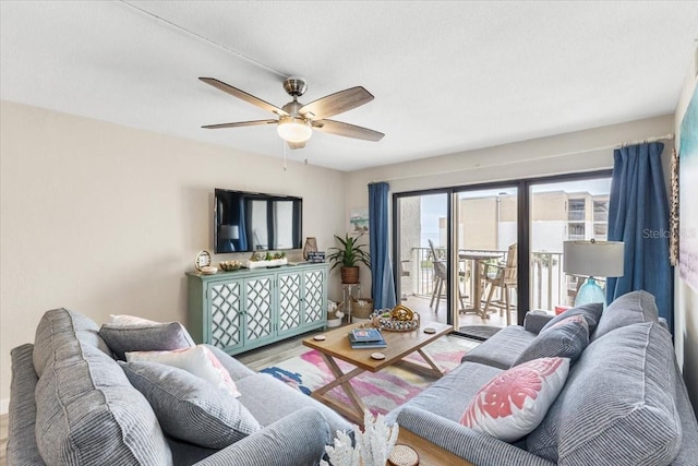 living room featuring hardwood / wood-style flooring and ceiling fan