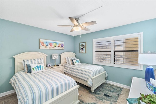 bedroom featuring ceiling fan and light hardwood / wood-style floors