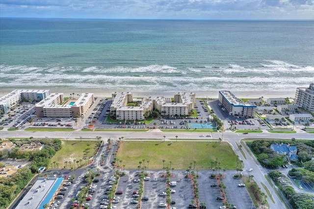 aerial view featuring a water view and a view of the beach