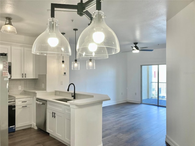 kitchen with sink, stainless steel appliances, white cabinetry, and tasteful backsplash