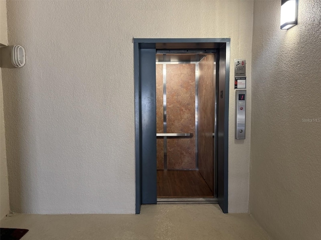 entrance to property featuring elevator