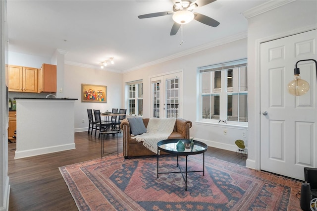 living room featuring ceiling fan, dark wood-type flooring, crown molding, and french doors