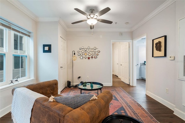 living room with dark wood-type flooring, plenty of natural light, and ornamental molding