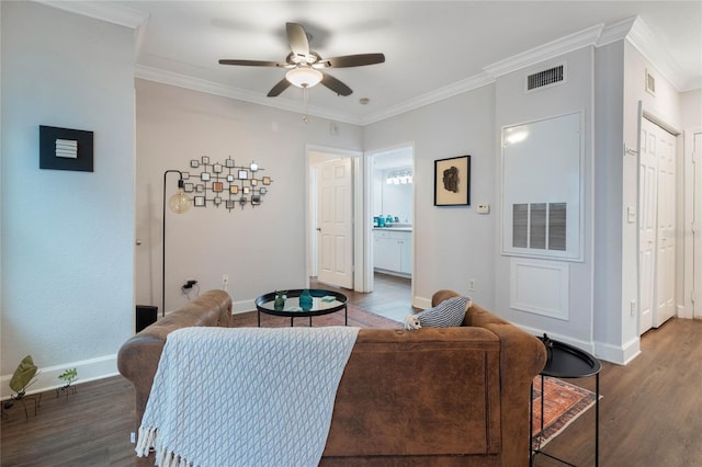 living room with crown molding, ceiling fan, and dark hardwood / wood-style flooring