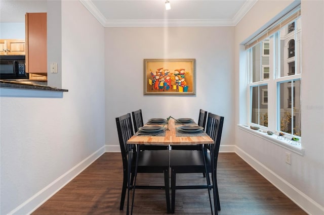 dining area featuring crown molding and dark hardwood / wood-style flooring