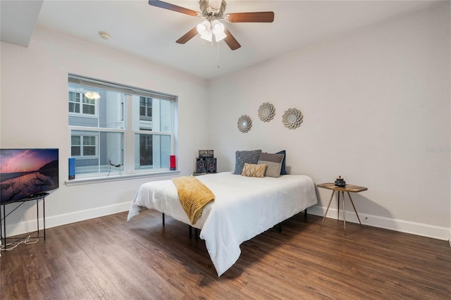 bedroom featuring ceiling fan and dark hardwood / wood-style floors