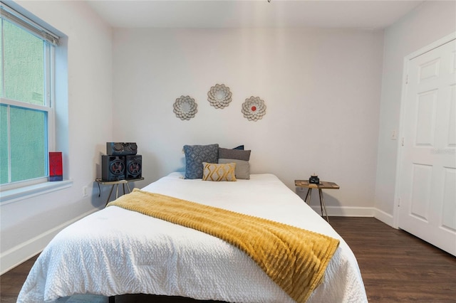 bedroom featuring dark wood-type flooring