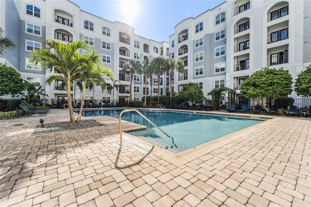 view of swimming pool with a patio