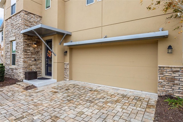 view of exterior entry featuring a garage