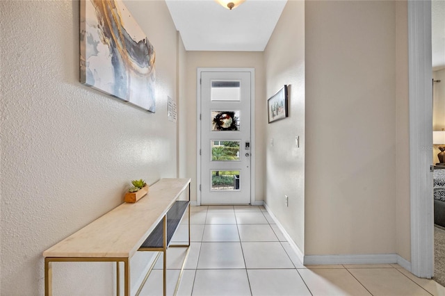 doorway featuring light tile patterned floors