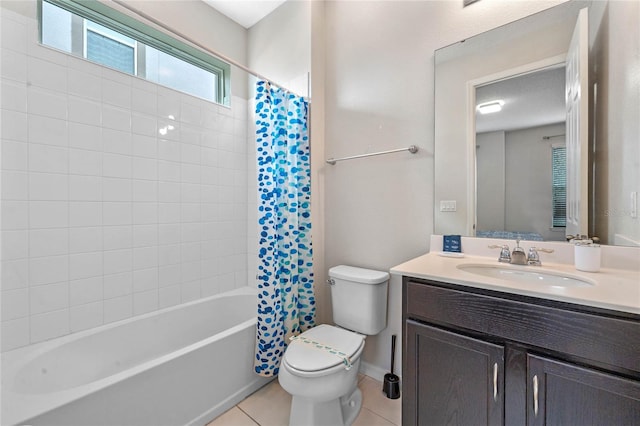 full bathroom featuring toilet, vanity, tile patterned floors, and shower / bathtub combination with curtain