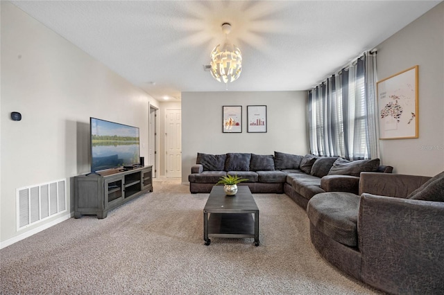 carpeted living room with a textured ceiling