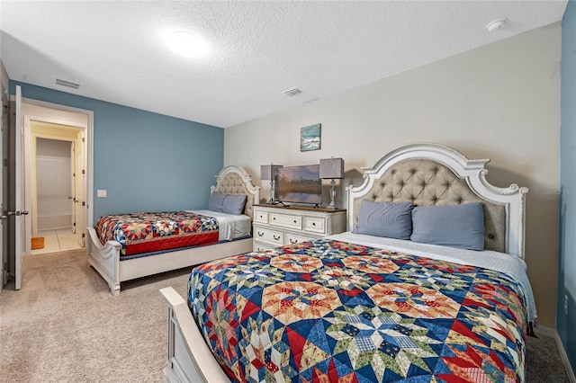 carpeted bedroom with a textured ceiling