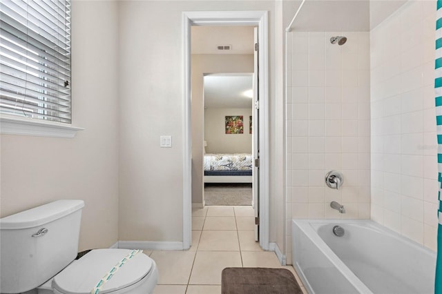 bathroom with tile patterned floors, toilet, and shower / tub combo with curtain