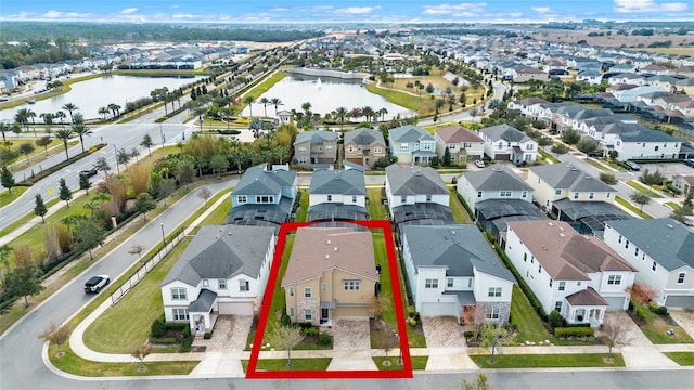 birds eye view of property featuring a water view