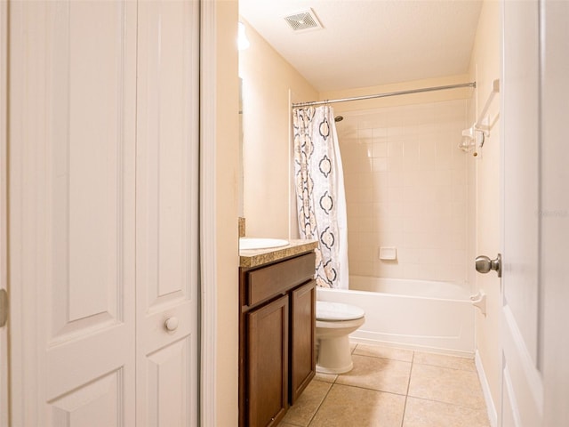 full bathroom with shower / tub combo with curtain, vanity, a textured ceiling, tile patterned floors, and toilet