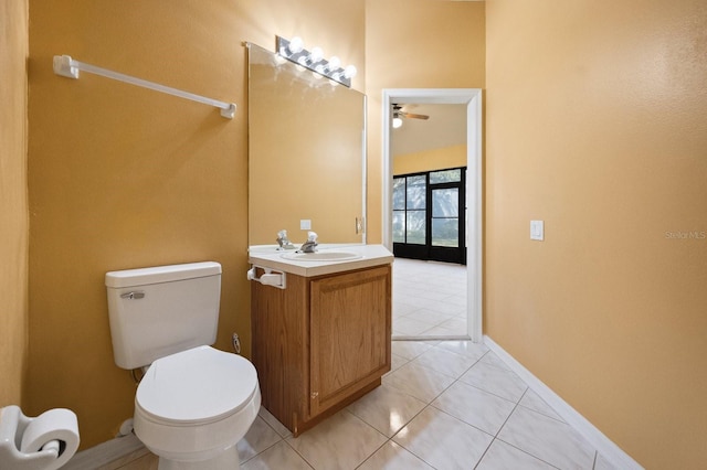 bathroom with ceiling fan, tile patterned floors, toilet, and vanity