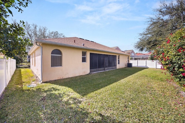 rear view of house with a lawn