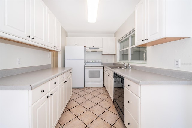 kitchen with light tile patterned floors, white appliances, sink, and white cabinets