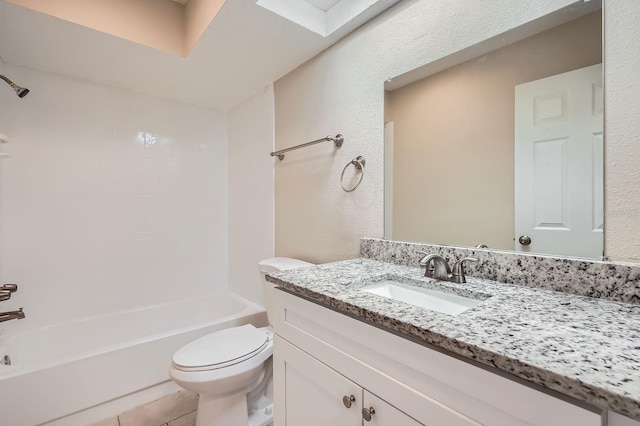 full bathroom with tile patterned flooring, vanity,  shower combination, and toilet