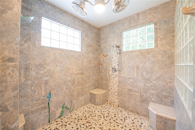 bathroom with tiled shower