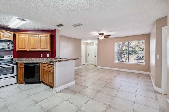 kitchen featuring sink, ceiling fan, dark stone countertops, black appliances, and a textured ceiling