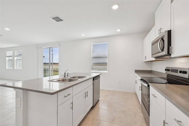 kitchen featuring light tile patterned floors, visible vents, appliances with stainless steel finishes, a sink, and recessed lighting