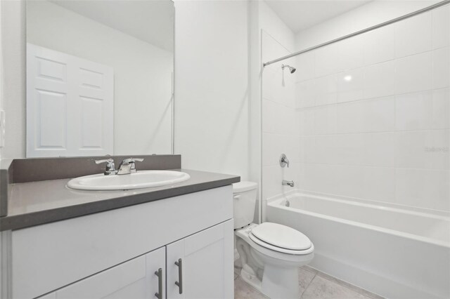 bathroom featuring vanity, toilet, and shower / bathtub combination