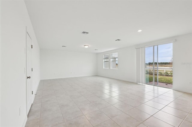 spare room with recessed lighting, visible vents, and light tile patterned floors