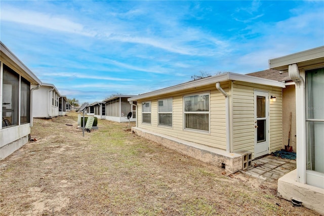 view of side of property featuring a yard