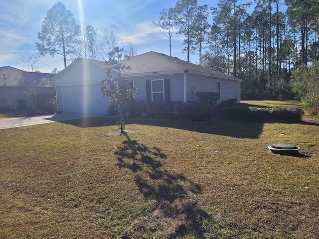 exterior space featuring a garage and a front yard