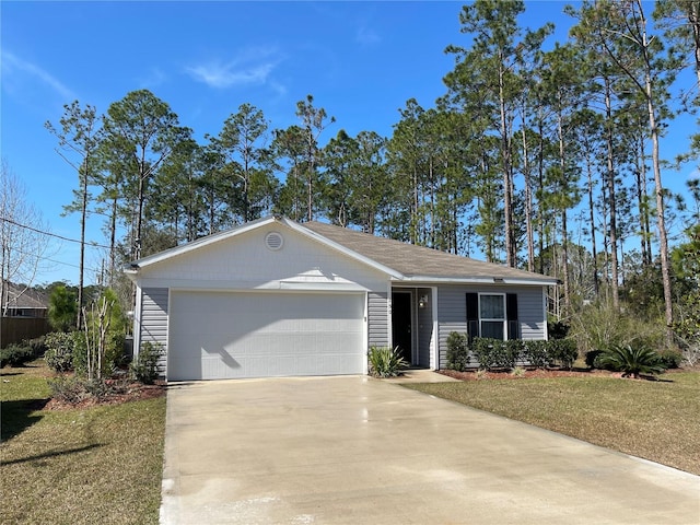 ranch-style house featuring a front yard, concrete driveway, and an attached garage