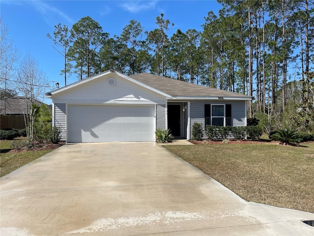 ranch-style home with a front yard, concrete driveway, and an attached garage