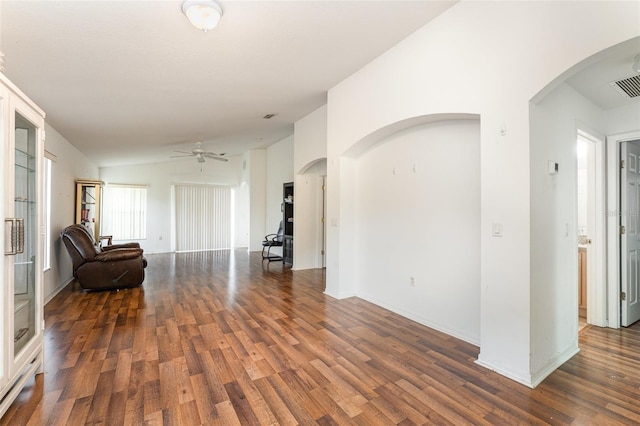 interior space with dark hardwood / wood-style flooring, lofted ceiling, and ceiling fan