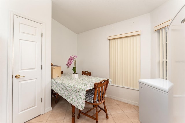 dining space with light tile patterned flooring