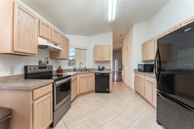 kitchen featuring light tile patterned floors, sink, light brown cabinets, and black appliances