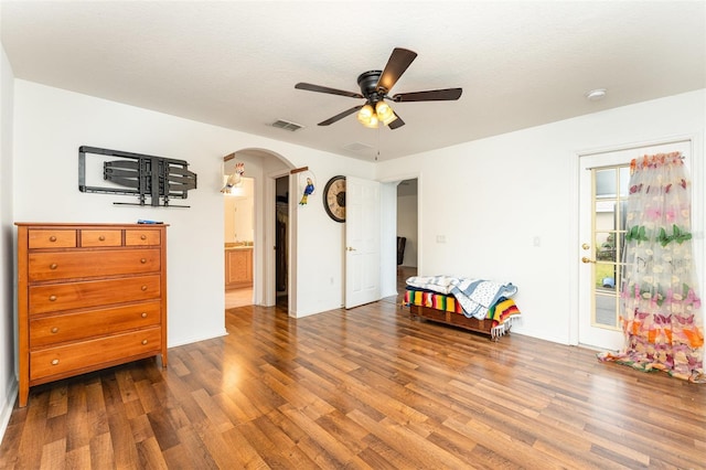 interior space with hardwood / wood-style flooring, ceiling fan, and a textured ceiling