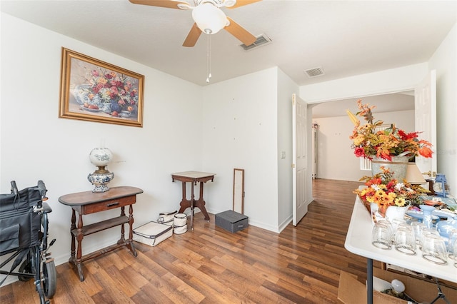 misc room featuring dark hardwood / wood-style floors and ceiling fan