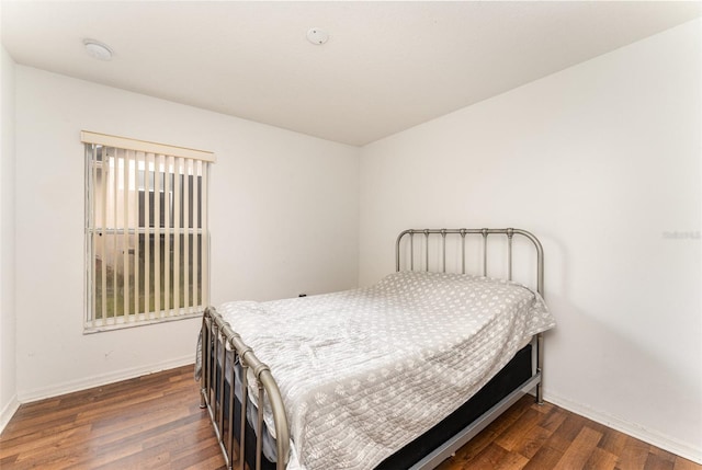 bedroom featuring dark wood-type flooring