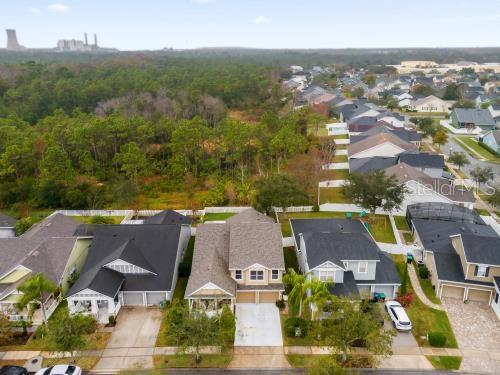 birds eye view of property with a residential view