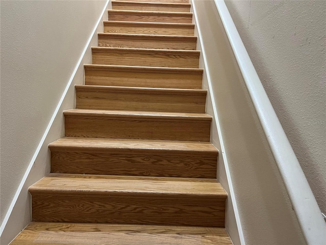 stairs with a textured wall