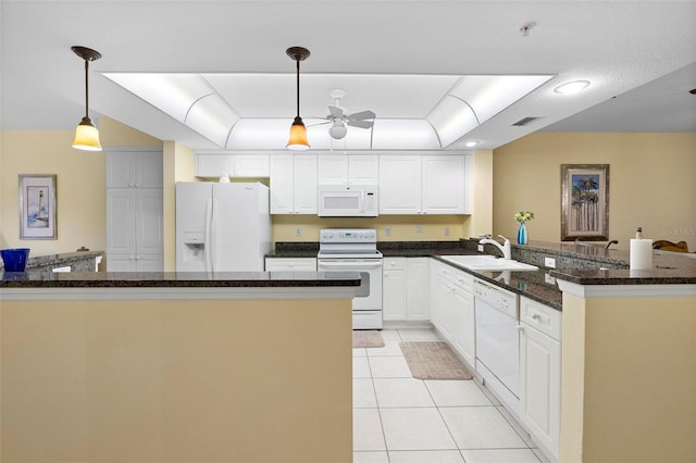 kitchen with white appliances, pendant lighting, white cabinetry, sink, and light tile patterned floors