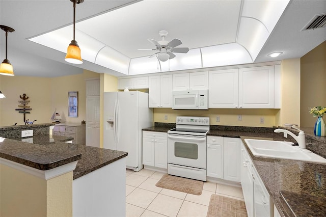 kitchen featuring white appliances, decorative light fixtures, white cabinetry, sink, and light tile patterned floors